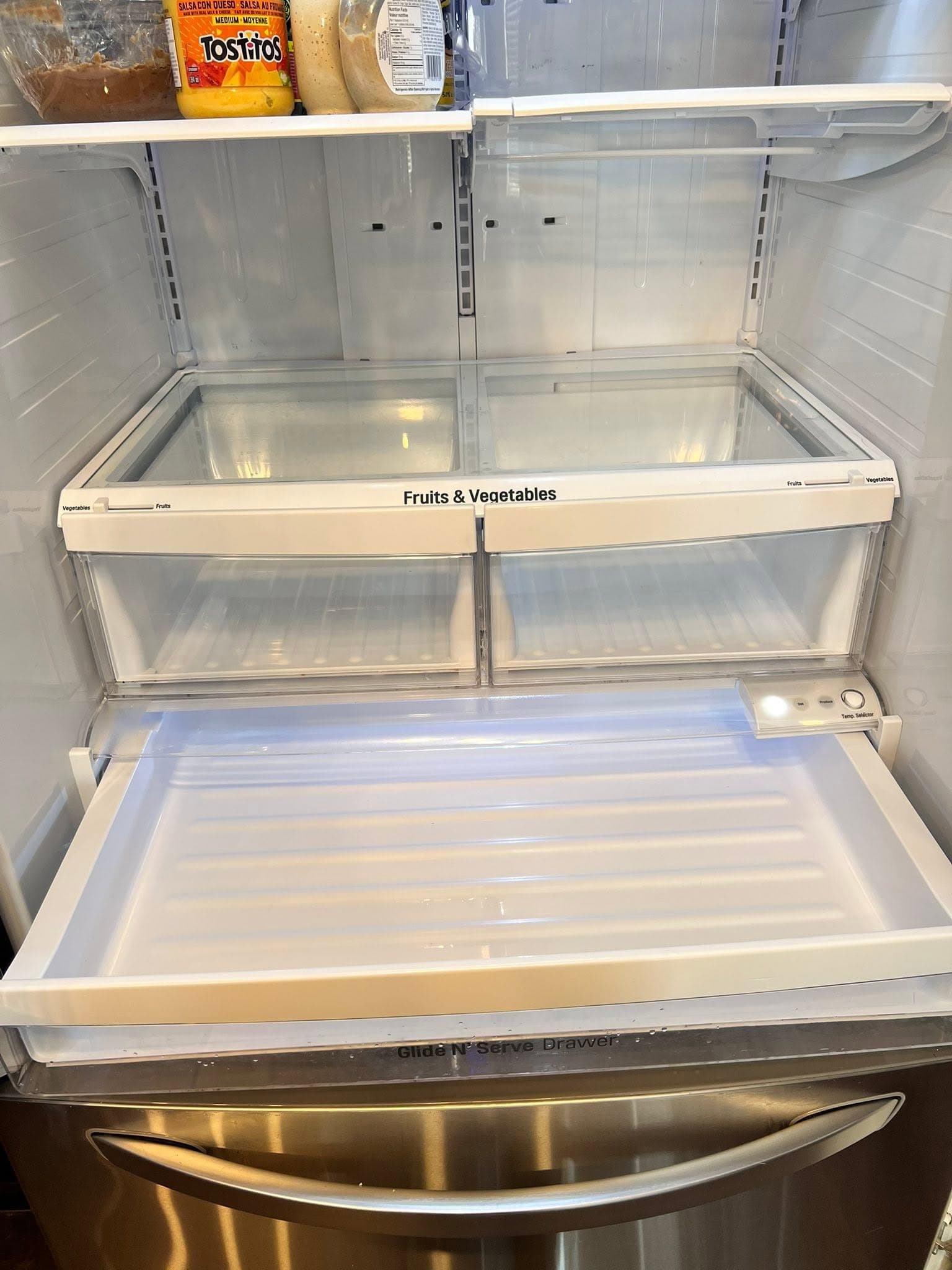 Detailed refrigerator deep cleaning by professional cleaners